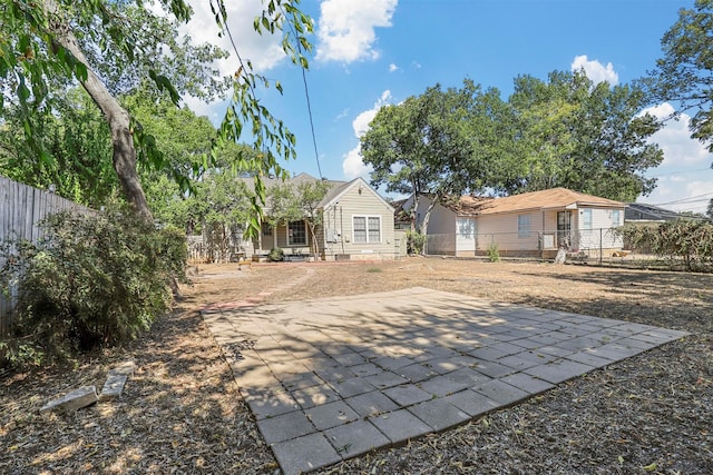 rear view of house featuring a patio