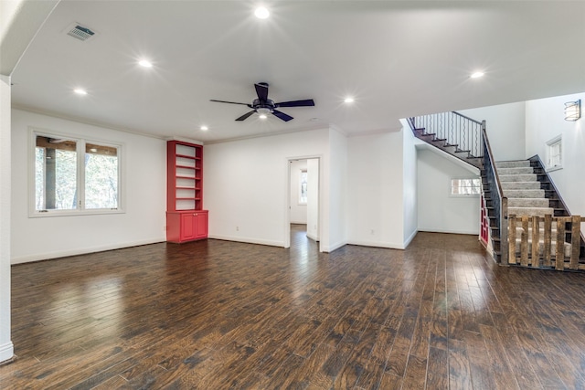 unfurnished living room with crown molding, dark hardwood / wood-style floors, and ceiling fan