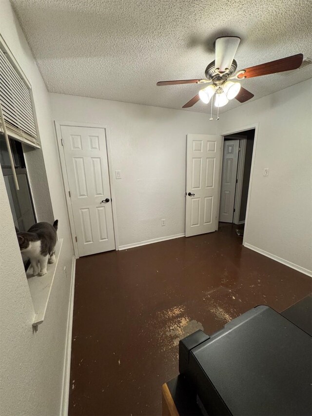 bedroom featuring a textured ceiling and ceiling fan