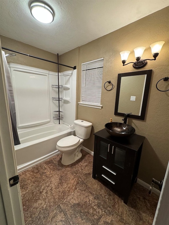 full bathroom featuring shower / tub combo with curtain, vanity, a textured ceiling, and toilet