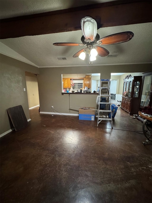 living room with ceiling fan and a textured ceiling