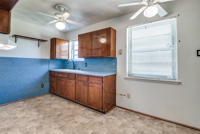 kitchen featuring sink and ceiling fan