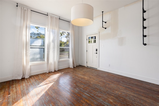 spare room featuring dark hardwood / wood-style floors