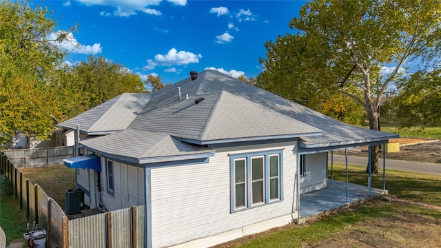 rear view of house featuring a patio and central AC unit