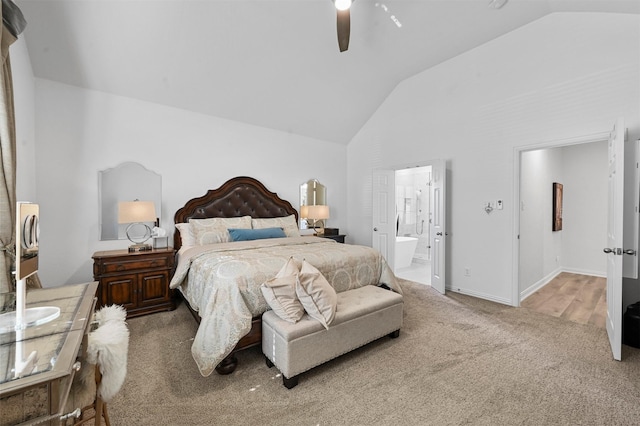 carpeted bedroom with lofted ceiling, ceiling fan, and ensuite bathroom