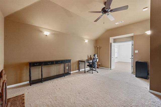 office area featuring vaulted ceiling, ceiling fan, and carpet