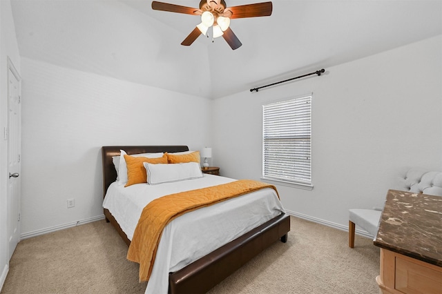 carpeted bedroom featuring vaulted ceiling and ceiling fan