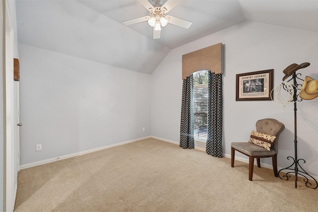 living area with ceiling fan, light colored carpet, and lofted ceiling