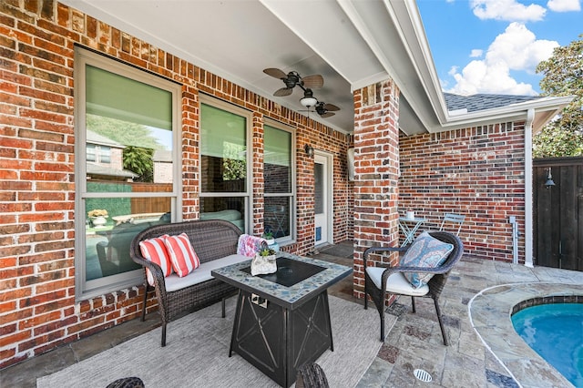 view of patio / terrace featuring ceiling fan