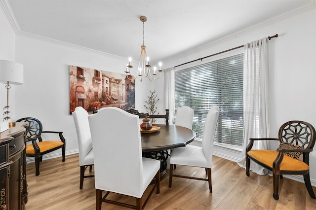 dining space with a notable chandelier, crown molding, and light wood-type flooring