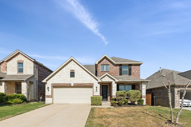 view of front facade with a garage and a front lawn