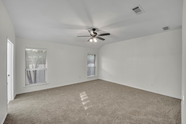 carpeted spare room featuring ceiling fan