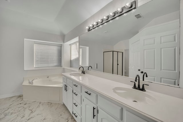 bathroom featuring plus walk in shower, vanity, and vaulted ceiling