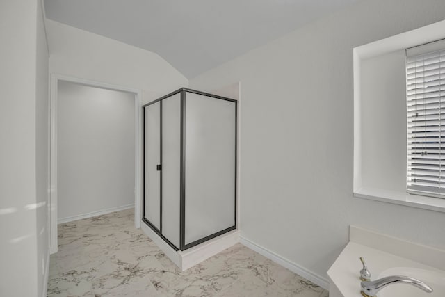 bathroom featuring separate shower and tub and vaulted ceiling