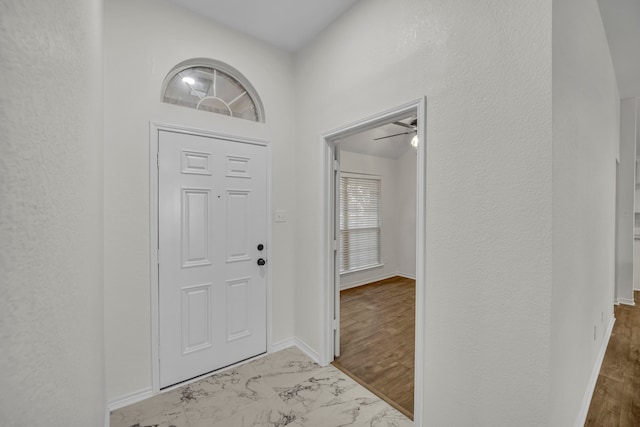 entryway featuring ceiling fan and light hardwood / wood-style floors