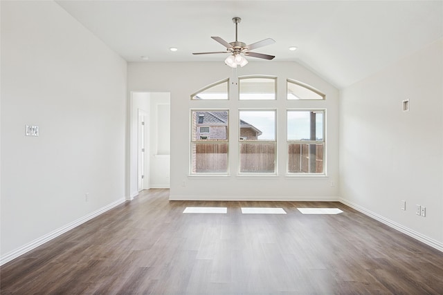 unfurnished living room with lofted ceiling, ceiling fan, and dark hardwood / wood-style floors