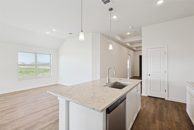 kitchen with dishwasher, hanging light fixtures, an island with sink, white cabinets, and sink