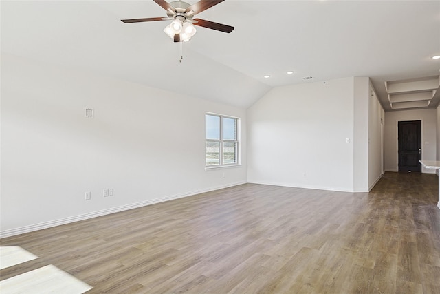 spare room featuring lofted ceiling, ceiling fan, and light hardwood / wood-style flooring