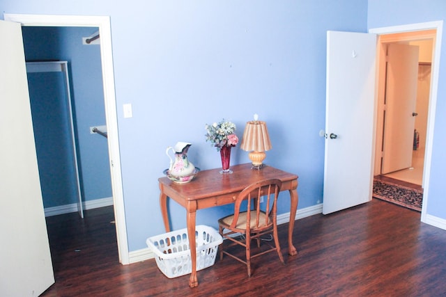 office featuring baseboards and wood finished floors