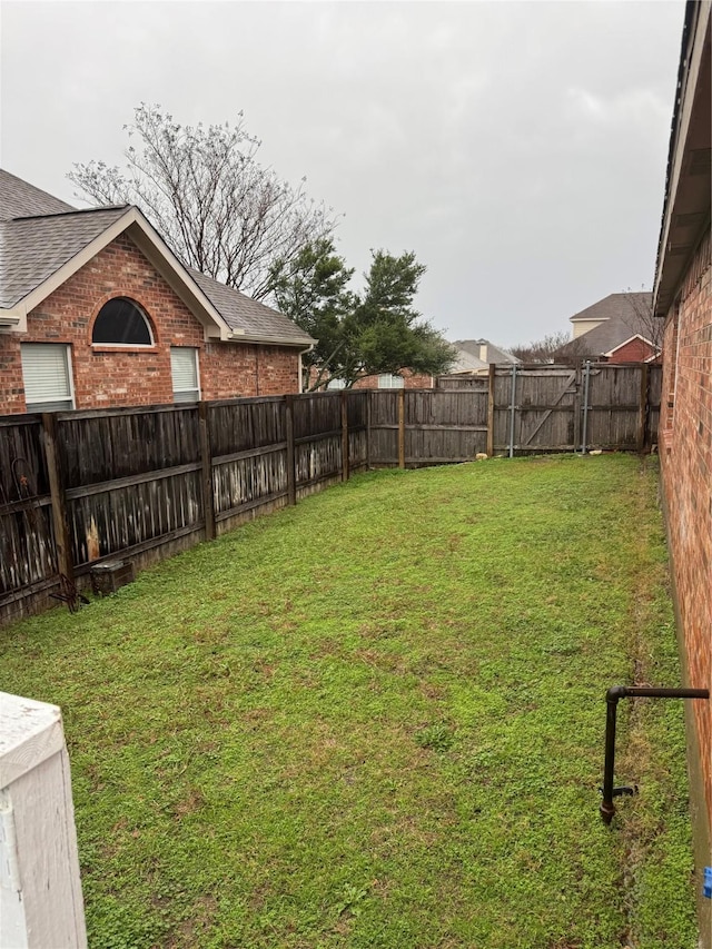 view of yard featuring a fenced backyard