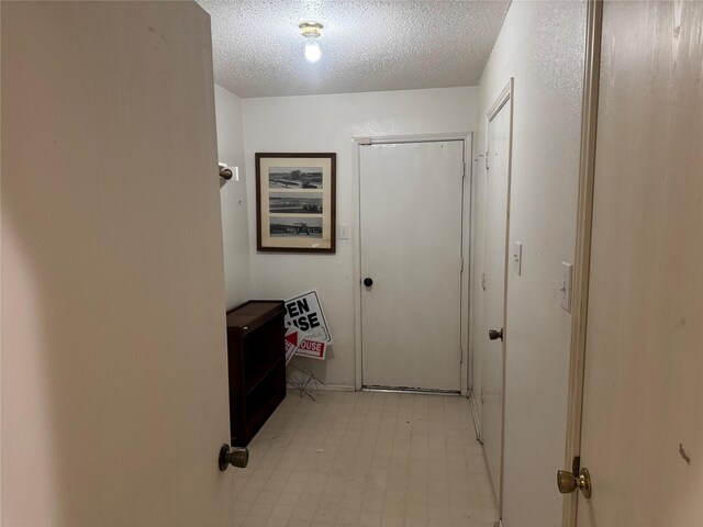 hallway with baseboards and dark wood-style flooring