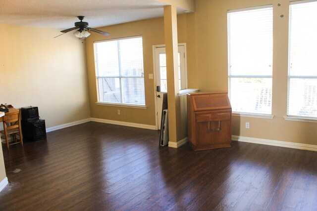 living room featuring wood-type flooring, a textured ceiling, a notable chandelier, and vaulted ceiling