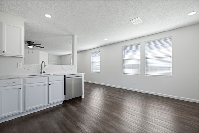 kitchen featuring white cabinetry, dark hardwood / wood-style floors, dishwasher, and sink