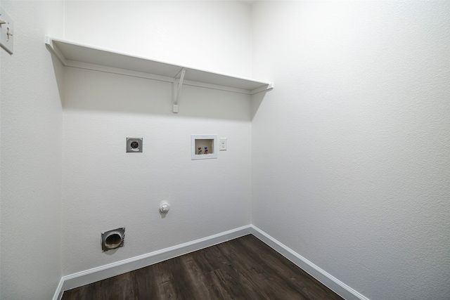 clothes washing area featuring hookup for an electric dryer, gas dryer hookup, hookup for a washing machine, and hardwood / wood-style flooring