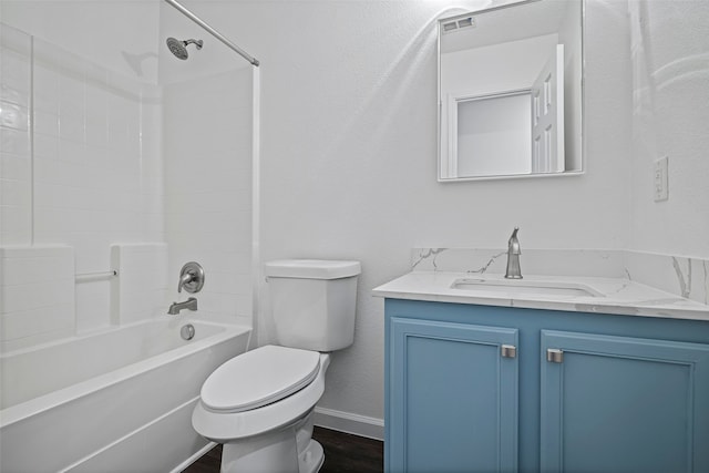 full bathroom featuring vanity, toilet, wood-type flooring, and bathing tub / shower combination