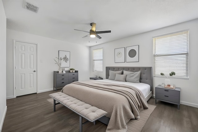 bedroom with dark wood-type flooring and ceiling fan