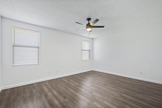 unfurnished room with ceiling fan, a textured ceiling, and dark hardwood / wood-style flooring