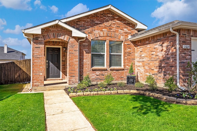 view of front of home with a front yard