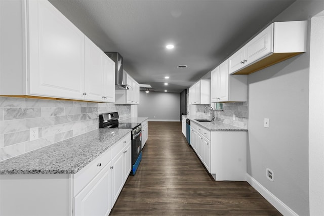 kitchen with white cabinetry, light stone counters, stainless steel appliances, and dark hardwood / wood-style flooring