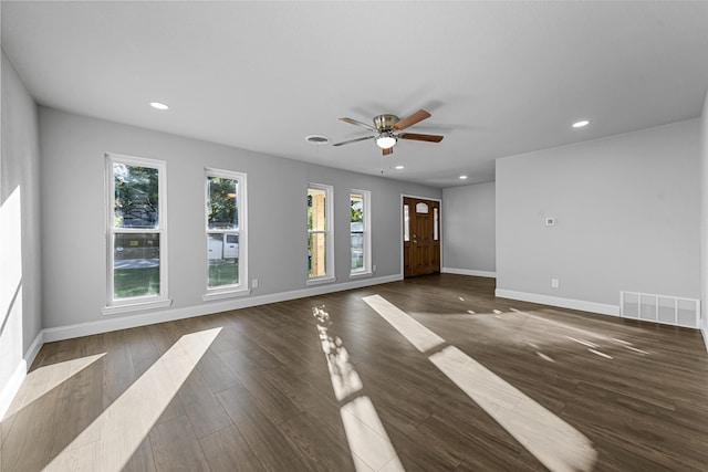 unfurnished room with dark hardwood / wood-style floors and ceiling fan