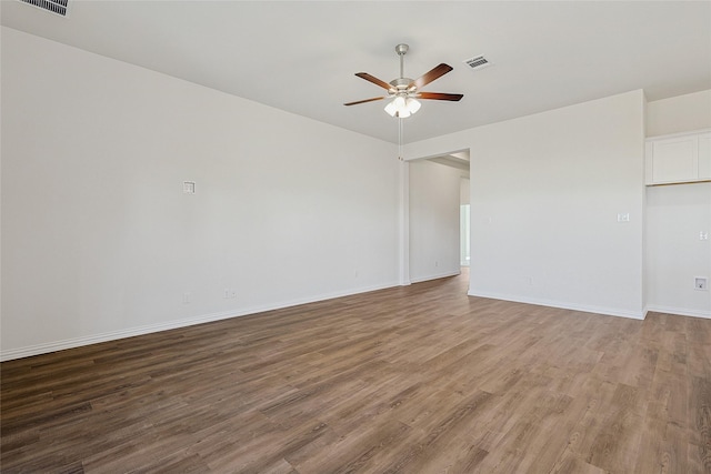 unfurnished room with ceiling fan and hardwood / wood-style flooring