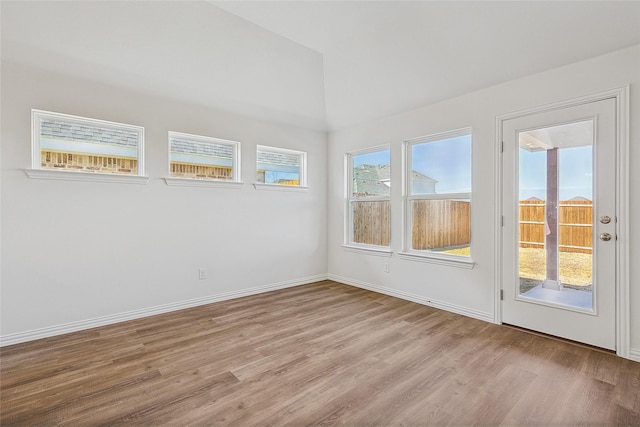 spare room with light hardwood / wood-style flooring