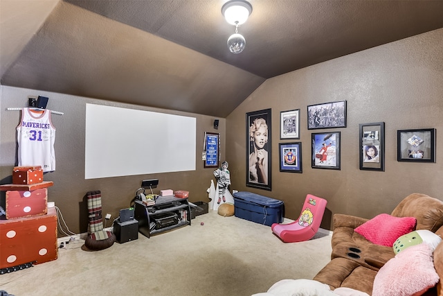 carpeted cinema featuring a textured ceiling and lofted ceiling