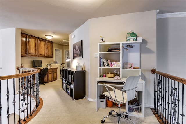 office space with ornamental molding and light colored carpet