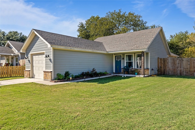 ranch-style house featuring a front yard and a garage