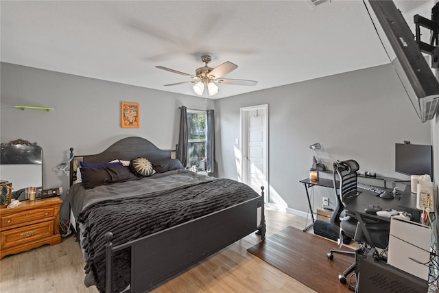 bedroom featuring ceiling fan and light wood-type flooring