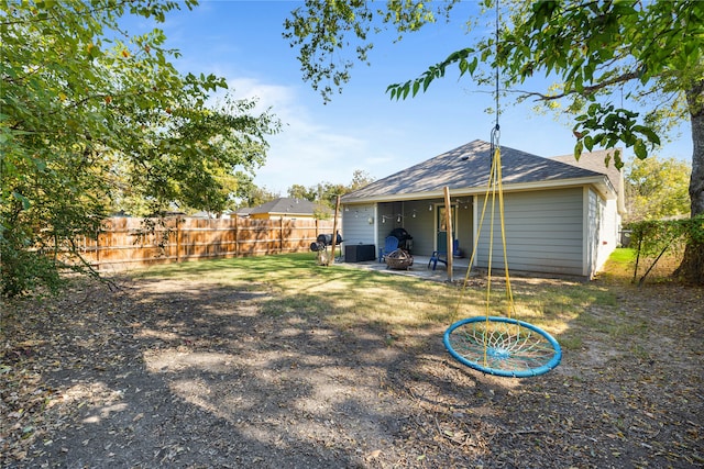 back of house featuring central AC