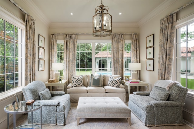 sunroom featuring a chandelier and plenty of natural light