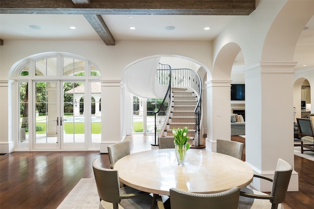 dining space with french doors, beamed ceiling, and dark wood-type flooring