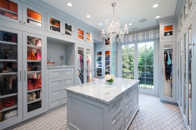 spacious closet with a notable chandelier