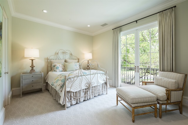 carpeted bedroom featuring crown molding and access to exterior