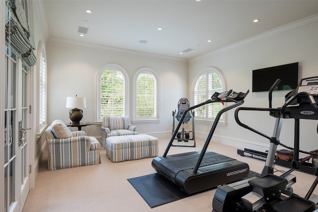 workout area featuring light carpet, crown molding, and french doors