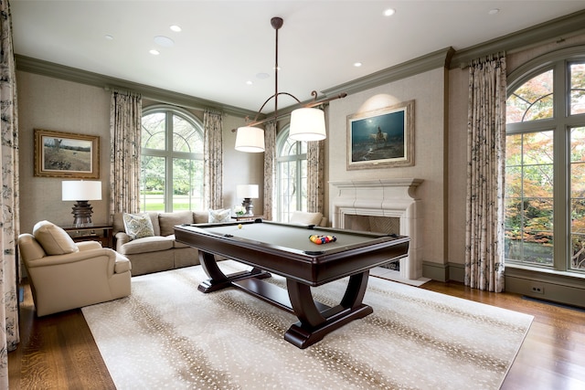 rec room with billiards, wood-type flooring, and plenty of natural light