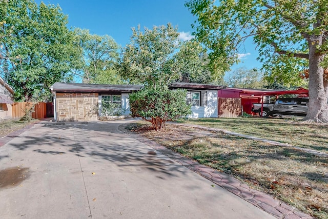 ranch-style home with a front yard