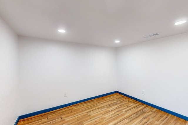 spare room with hardwood / wood-style floors