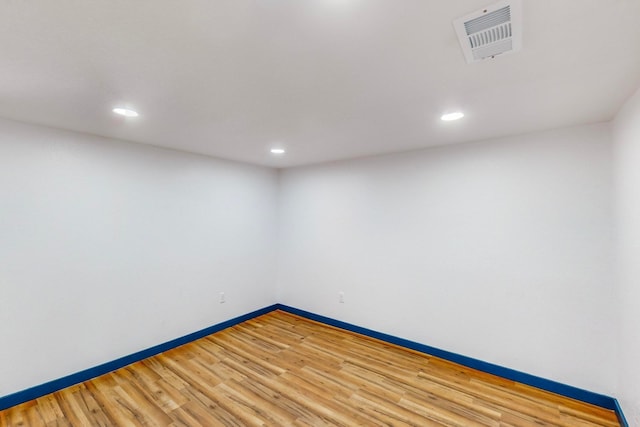 spare room featuring hardwood / wood-style flooring